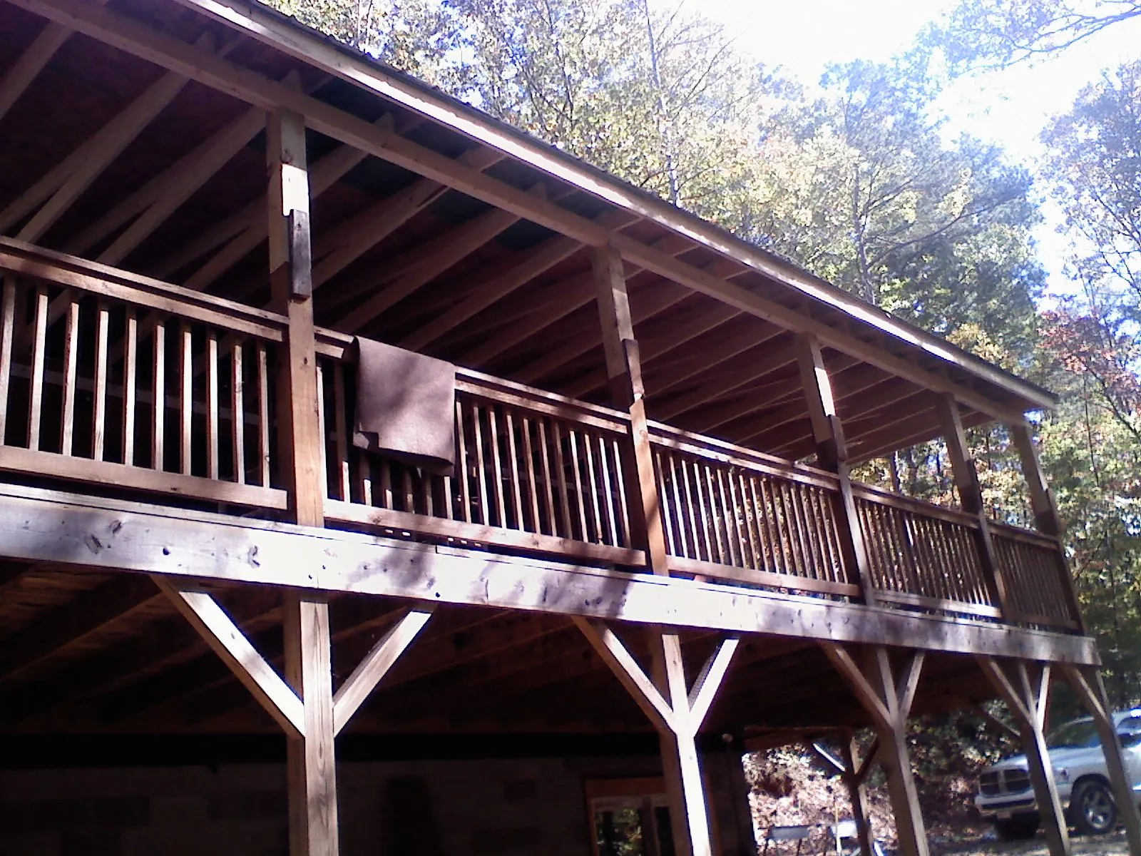 Timber framing under a new elevated porch and deck — Roof Leak Repair in Natick by Roofing Brothers